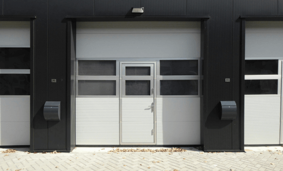 Modern white garage door installed in Arcadia, AZ by Pride Garage Doors.