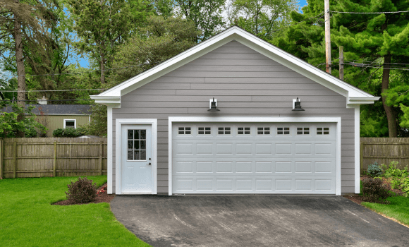 Garage door installation service for a home in Tempe, AZ by Pride Garage Doors.
