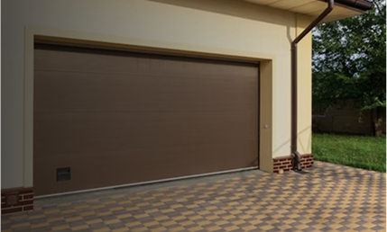 Residential garage door with newly repaired track and rollers.