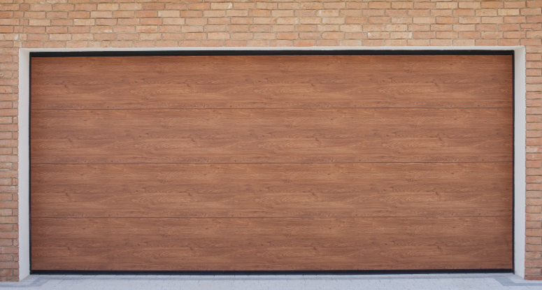 A modern wooden-textured garage door framed in sleek black, set against a backdrop of light brown brick wall.